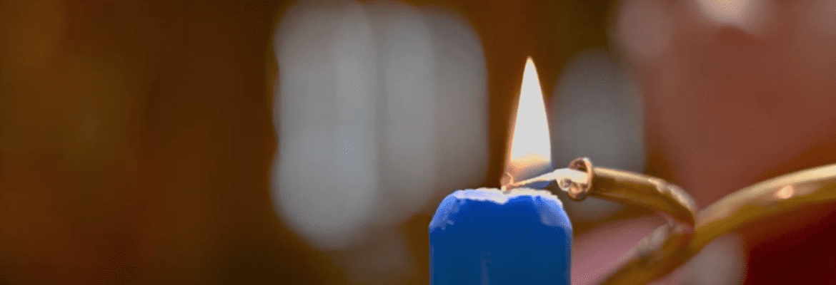 lighting a blue Advent candle