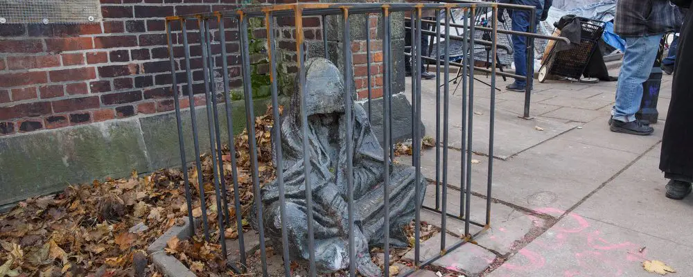 Statue of Jesus in a cage.