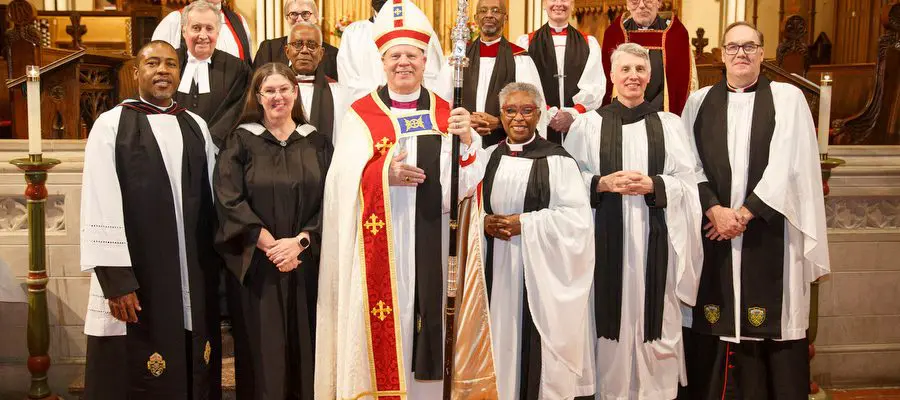 Group photo of archdeacons, canon administrator, bishops.