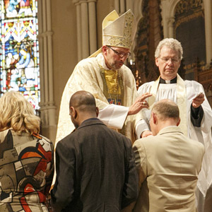 New Anglicans are officially received into the Anglican Church. Photo by Michael Hudson
