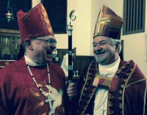 Archbishop Colin Johnson and Bishop John Chapman of the Diocese of Ottawa share a laugh at Archbishop Johnson's installation as the Bishop of Moosonee on April 1 in Cochrane, Ontario.