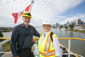 The Rev. Judith Alltree visits with Andre Hamel, the wheelsman on the Stephen B. Roman.