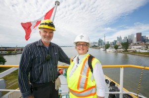 The Rev. Judith Alltree visits with Andre Hamel, the wheelsman on the Stephen B. Roman. 