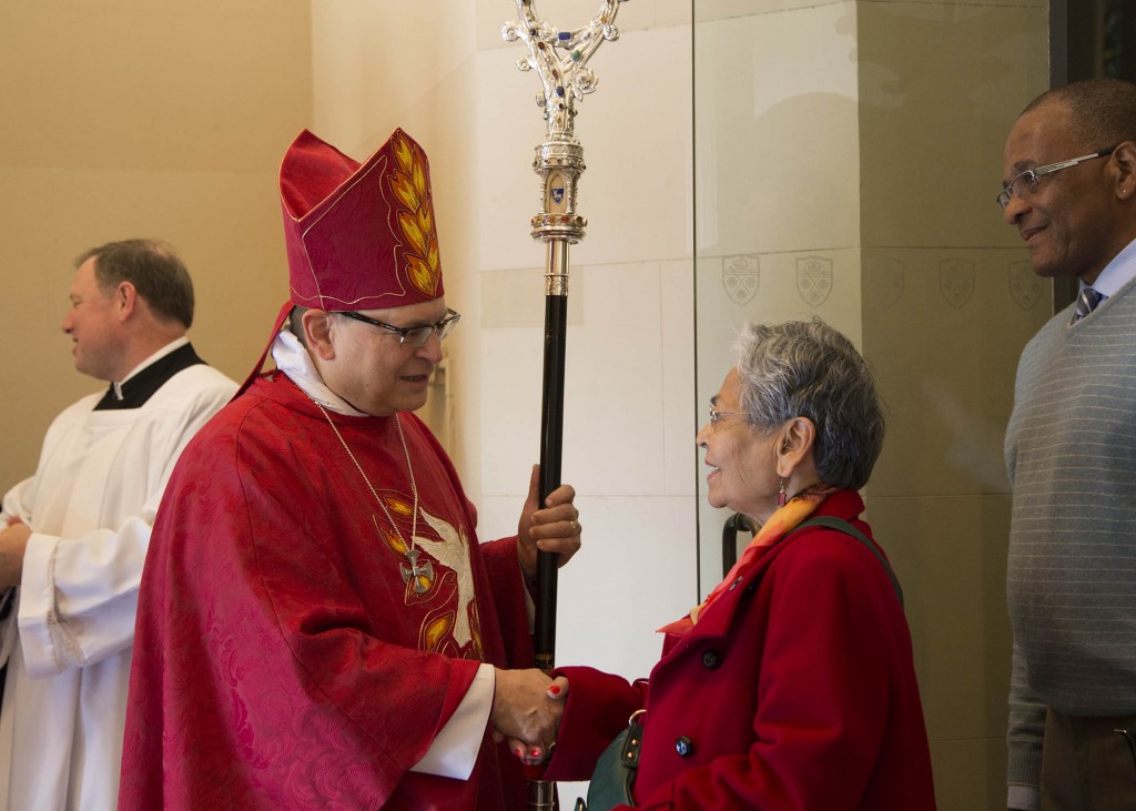 Greeting parishioners after the service. 