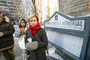 People stand beside the homeless memorial outside Holy Trinity, Trinity Square during a service on Jan. 13. Photos by Michael Hudson