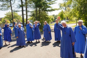 Sister Elizabeth Rolfe-Thomas, second from right, waves with other Sisters at St. John's Convent last summer. Photo by Michael Hudson