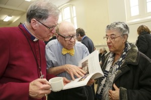 Fred Hiltz looks through a history of St. Martin in-the-Fields.