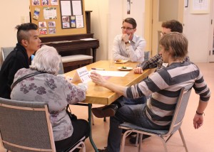 Christian Hui of Asian Community AIDS Services speaks with one of his table groups. 