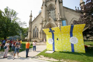 Canada's first Gift Box, an inter-active display on human trafficking, installed in front of St. James Anglican Cathedral in Toronto on July 12, 2015. Gift Box, designed by students at OCAD university, is a project of The Faith Alliance to End Human Trafficking and open to visitors during the 2015 Pan Am and Parapan Am Games. Photo/Michael Hudson