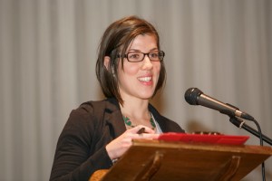 Liana Honsinger of the New Canadians Centre in Peterborough speaks at the Orono meeting.