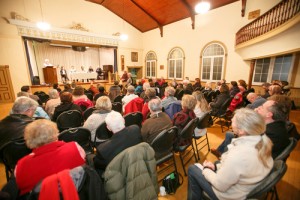 Supporters listen to a panel of experts on refugee sponsorship at a town hall in Orono. Photo by Michael Hudson 