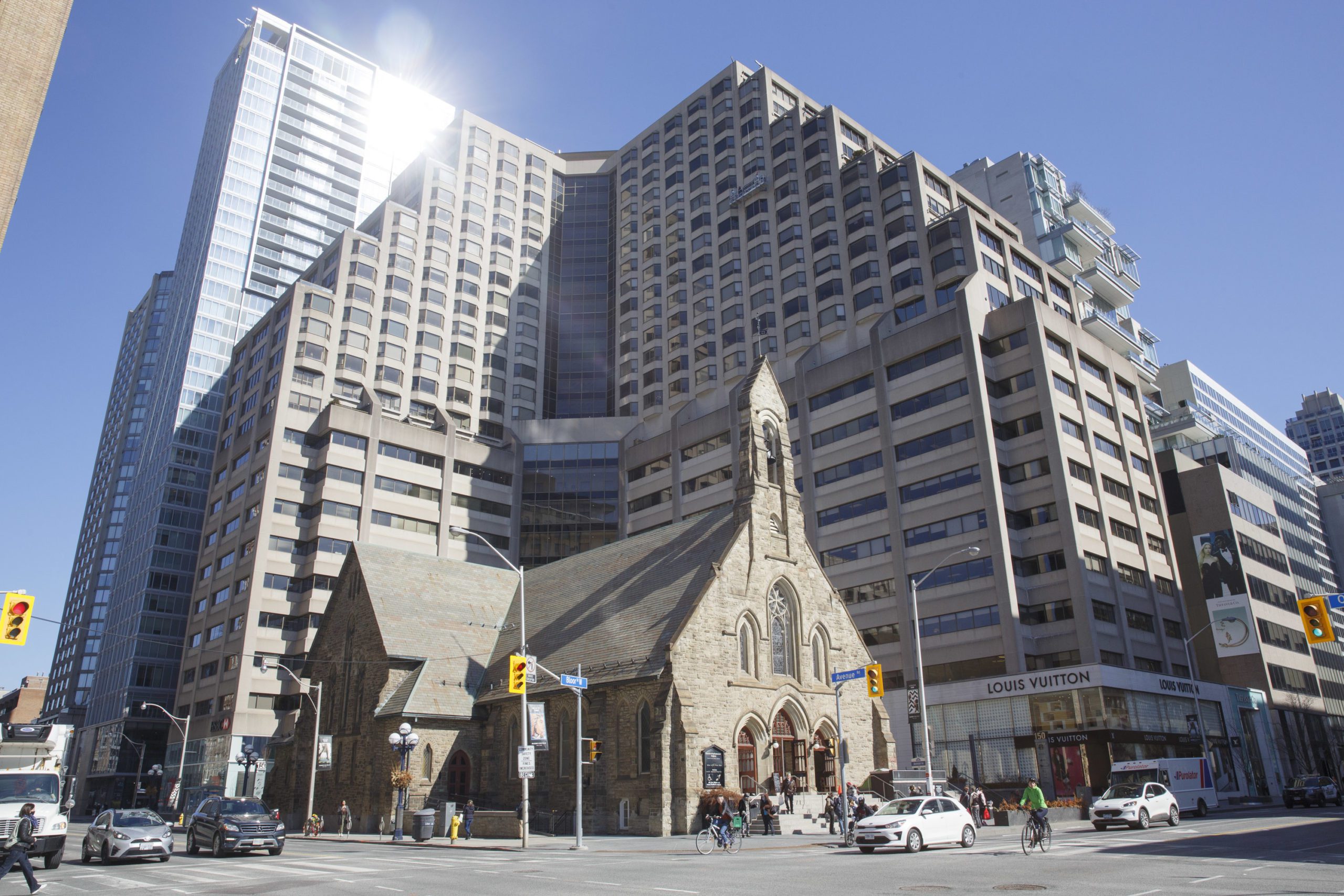 Church of the Redeemer with the Four Seasons Renaissance Centre and high-rises.