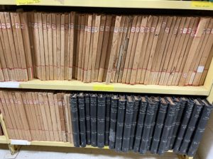 photo of shelves showing volumes of Canon Allen's notes