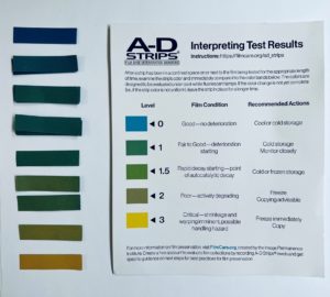 Image showing an A-D strip test result chart, showing the level of deterioration based on colour with blue being fine and yellow severe deterioration, along with strips used on our collection